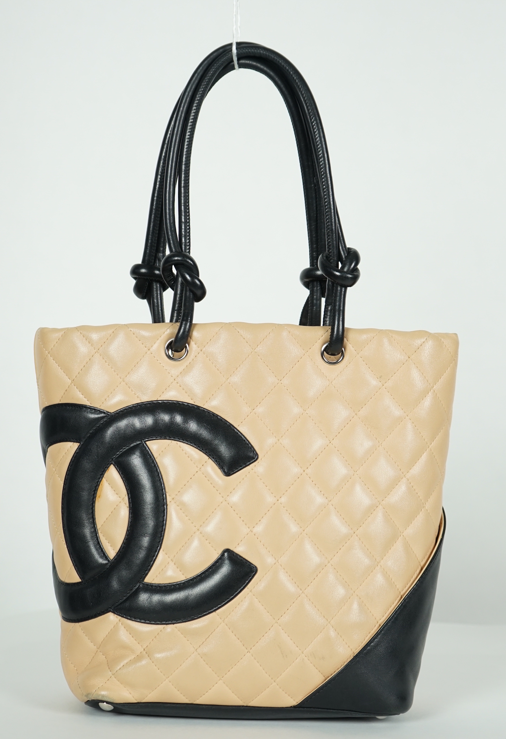 A Chanel Cambon Ligne black and beige quilted leather tote, width 26cm, height 24cm, overall height 40cm, depth 11cm, Please note this lot attracts an additional import tax of 20% on the hammer price